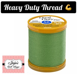 May include: A spool of green Coats Dual Duty Plus thread for topstitching jeans. The spool is labeled "60 yds. 54 m" and "Surpiq&ucirc;re fil &agrave; jeans Costura a la vista para jeans Mexico".