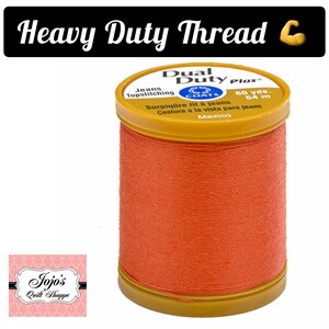 May include: A spool of orange Coats Dual Duty Plus thread for topstitching jeans. The spool is labeled "60 yds. 54 m" and "Surpiq&ucirc;re fil &agrave; jeans Costura a la vista para jeans Mexico".