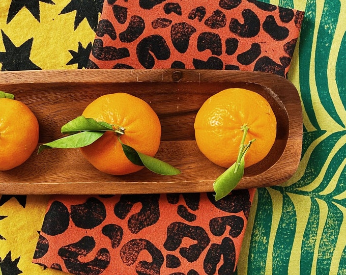 linen dinner napkins. black cheetah print on burnt orange. hand block printed. placemats / tea towel. tropical. boho decor. leopard. animal.