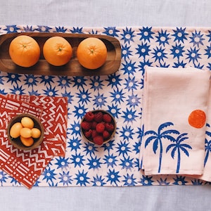 hand block printed table runner. sun burst on blush pink. boho decor. beach house. coastal. linen tablecloth. stars. star pattern.