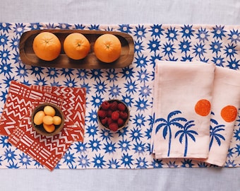 hand block printed table runner. sun burst on blush pink. boho decor. beach house. coastal. linen tablecloth. stars. star pattern.