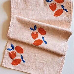 hand block printed table runner. oranges on blush pink. boho decor. linen tablecloth. birthday or dinner party decor. image 1