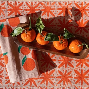 hand block printed table runner. floral dots on blush pink. boho decor. linen tablecloth. preppy beach house. abstract. orange. easter. image 1