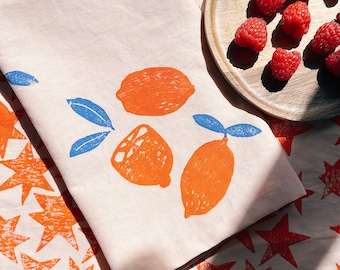 linen dinner napkins. oranges on blush. hand block printed. placemats / tea towel. vases. boho decor. hostess gifting.