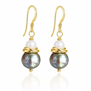 May include: A pair of gold-colored drop earrings. Each earring features a large, iridescent, dark gray pearl, a smaller white pearl, and gold-colored wire detailing. The earrings have a gold-colored hook closure.