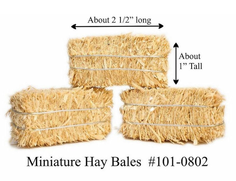 May include: Three miniature hay bales, each about 2 1/2 inches long and 1 inch tall. Miniature Hay Bales #101-0802