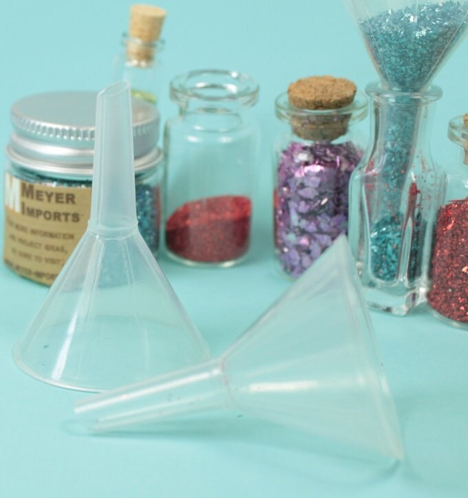 How does one get glitter into a tiny Glass Vial? With a tiny funnel! -  Meyer Imports