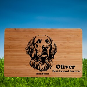 May include: A rectangular bamboo cutting board featuring a detailed black illustration of an Irish Setter's face. The board is engraved with the name "Oliver" and the phrase "Best Friend Forever" below the dog's image. The words "Irish Setter" are also included.