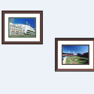 May include: Two framed photographs of a baseball stadium. The first photo shows the exterior of the stadium with the words "Tigers" and "Park" visible. The second photo shows the interior of the stadium with the field and bleachers visible.