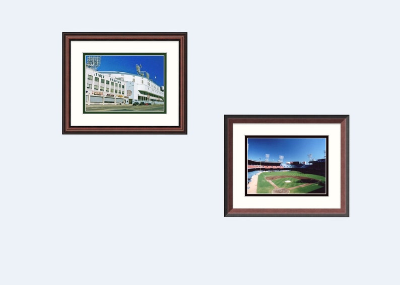 May include: Two framed photographs of a baseball stadium. The first photo shows the exterior of the stadium with the words "Tigers" and "Park" visible. The second photo shows the interior of the stadium with the field and bleachers visible.