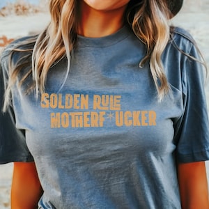 Fallout Lucy Quote Shirt. Golden Rule, Motherf*cker Shirt. Funny Gamer Shirt. Funny TV Show Shirt. Fallout Themed Shirt for Vault Dwellers.