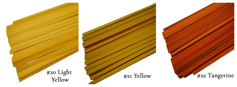 May include: Three bundles of paper strips in different shades of yellow. The bundles are labeled #20 Light Yellow, #21 Yellow, and #22 Tangerine.