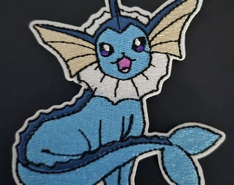 Toppa Vaporeon versione argento/oro