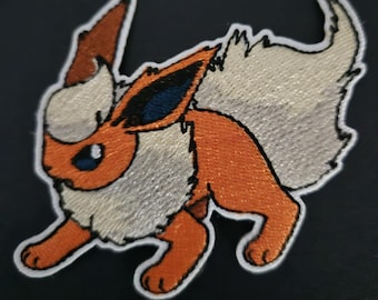 Toppa Flareon versione argento/oro