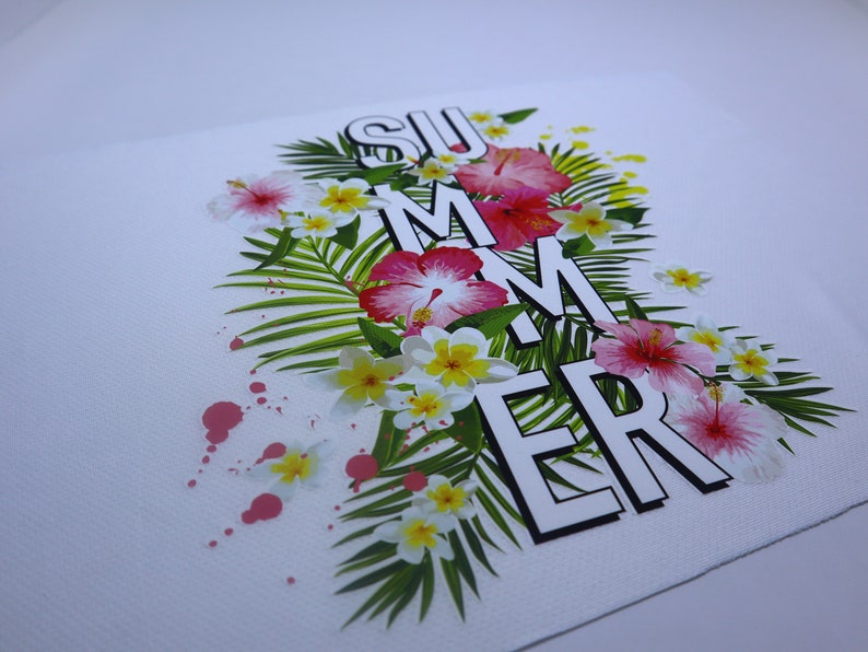 May include: A white background with the word "SUMMER" in black letters with white outlines. The letters are surrounded by pink and white flowers and green palm leaves. There are pink paint splatters on the background.
