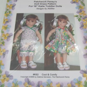 May include: A doll dress pattern for 18-inch Katie Toddler Dolls. The pattern features two doll outfits: a floral print top and shorts set, and a floral dress. The text reads "The Patchwork Pansy's Doll Dress Pattern".