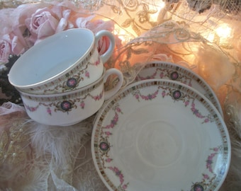 pair antique teacups saucers, shabby sweet garlands of tiny pink roses, black accents, germany, 1910s