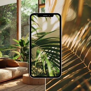 May include: A close-up of a smartphone displaying a photo of a green plant with sunlight shining through the leaves. The phone is on a wooden table in a room with large windows.