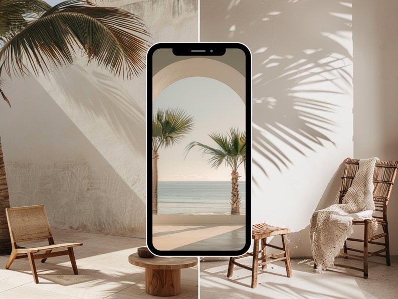 May include: A smartphone displaying a photo of a beach scene through an archway. The phone is sitting on a wooden table in a room with a wicker chair and a white wall. The wall has shadows of palm trees cast on it.