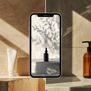 May include: A white tube of lotion and a black glass bottle with a dropper are displayed on a white platform. The scene is photographed on a smartphone screen, which is placed on a beige surface.