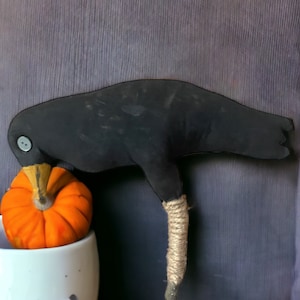 Primitive crow on a stick for fall and Halloween
