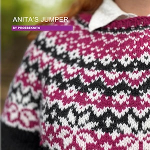 May include: Close-up of a black, white, and pink knitted sweater with a geometric pattern. The sweater has a crew neck and is made with a chunky yarn. The text "ANITA'S JUMPER BY PHOEBEKNITS" is visible at the top of the image.