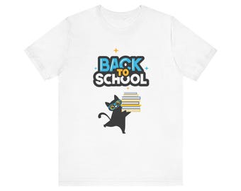 May include: White t-shirt with a black cat wearing glasses and holding a stack of books. The text "BACK TO SCHOOL" is printed in blue and yellow letters.