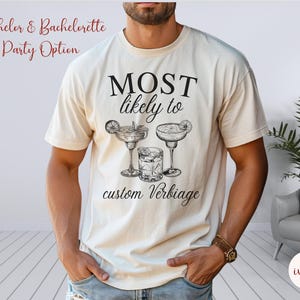 May include: A white t-shirt with the text "MOST likely to" and a graphic of three cocktails. The text "custom verbiage" is below the graphic.