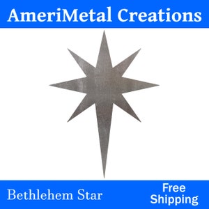 May include: A silver metal Bethlehem star with a pointed tip and eight points. The star has a brushed metal finish.