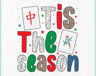 May include: Digital download graphic with the text "'Tis The Season" in red, green, and blue. The word "season" has a leopard print pattern. Includes Mahjong tiles and star accents. The top of the image reads "DIGITAL DOWNLOAD".