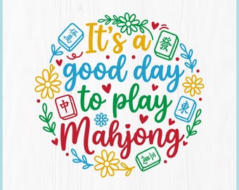 May include: A colorful digital download design with the text "It's a good day to play Mahjong" in a circular arrangement. The design includes Mahjong tiles, flowers, and hearts, with file format options below.