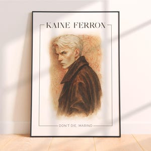 May include: Framed art print featuring a watercolor portrait of a man with blonde hair and a brown coat. The print includes the text "KAINE FERRON" at the top and "DON'T DIE, MARINO" at the bottom, set against a beige background.