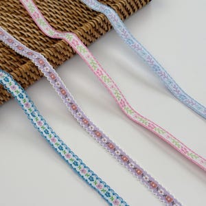 Cinta de jacquard con bordado floral: estilo vintage, 1 cm de ancho. Se vende cortada a medida.