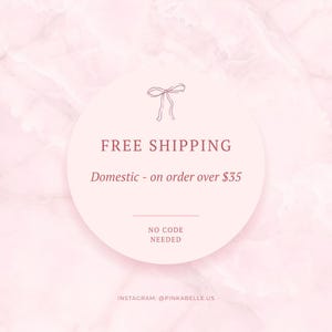 May include: A pink and white marble background with a circular graphic. The graphic features the words "FREE SHIPPING" in a serif font, along with the text "Domestic - on order over &pound;35" and "NO CODE NEEDED". The Instagram handle @PINKABELLE.US is at the bottom.