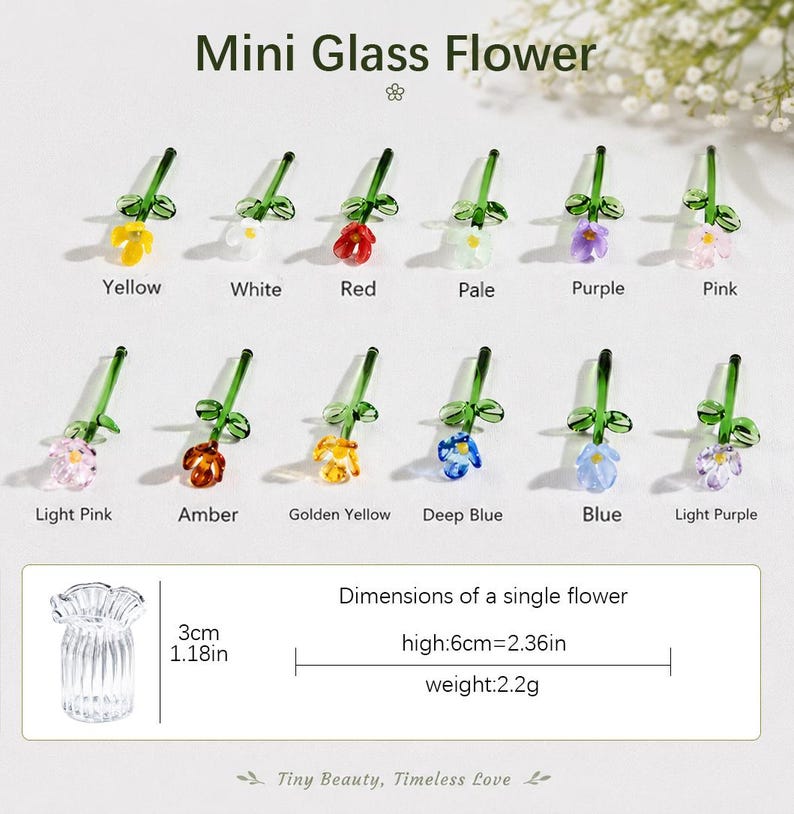 May include: A collection of twelve miniature glass flowers in various colours including yellow, white, red, pale, purple, pink, light pink, amber, golden yellow, deep blue, blue, and light purple, each with a green stem and leaves.