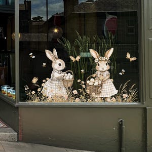 May include: A trio of ceramic mugs with a speckled, matte finish in cream, light grey, and dark grey. Each mug features a minimalist design and a rounded handle.