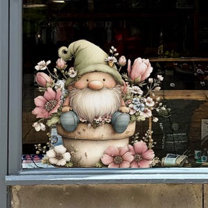 May include: A whimsical illustration of a garden gnome sitting in a flower pot, surrounded by pink and white flowers. The gnome wears a green hat and blue shoes, with a long white beard. The artwork has a soft, watercolor style.