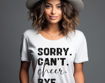 May include: White t-shirt with black text that reads "SORRY. CAN'T. cheer. BYE."