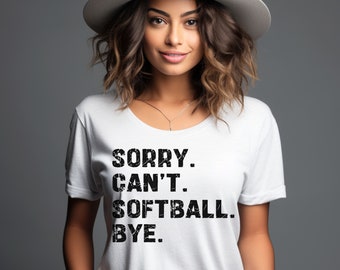 May include: White t-shirt with black text that reads "SORRY. CAN'T. SOFTBALL. BYE."