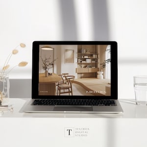 May include: A laptop displaying an interior design presentation with the word "INTRODUCTION" on the screen. The laptop is on a white surface, next to a glass of water and a vase with dried flowers. The Textbox Digital Studio logo is at the bottom.