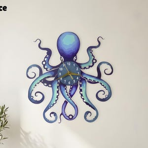 May include: A blue and teal octopus-shaped wall clock with a round clock face. The clock hands are gold. The clock is mounted on a white wall above a white sofa. The text "enchantingspace" is in the upper left corner.