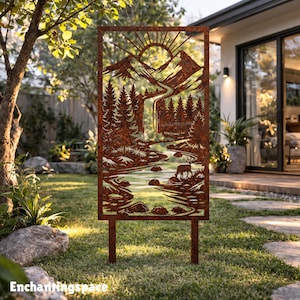 May include: A rectangular, rusty-brown metal garden art piece depicting a mountain landscape with a river, trees, and a deer. The sun is rising over the mountains. The text "Enchantingspace" is at the bottom. The art piece is set in a grassy yard.