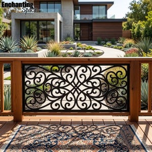 May include: A black metal railing panel featuring an intricate, symmetrical scrollwork pattern, mounted between two vertical wooden posts on a deck, with a patterned blue and beige area rug visible on the wooden floorboards in the foreground.