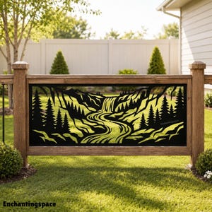 May include: A rectangular black metal decorative panel featuring a laser-cut landscape design of a winding river, a waterfall, and pine trees. The panel is mounted within a wooden frame. The text Enchantingspace is visible on the panel.