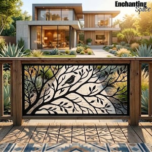 May include: A black metal decorative railing panel featuring a laser-cut design of a bird perched on a tree branch with leaves. The rectangular panel is mounted within a wooden frame on a deck, overlooking a modern house with large glass windows.