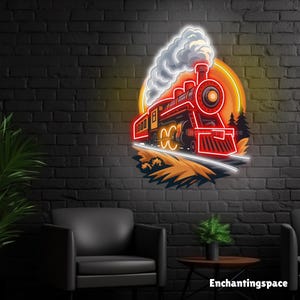 May include: A red neon train sign with a yellow and orange background, mounted on a black brick wall. The train is emitting white smoke and is positioned above a grassy area with two trees. The sign has the text "Enchantingspace" at the bottom.
