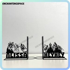 May include: Black metal bookends with a silhouette of chickens and the names "Alissa" and "Hey Hey" on each side.