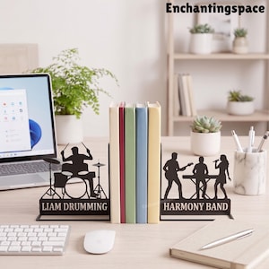 May include: A pair of black metal bookends featuring silhouettes of musicians. The left piece shows a drummer with the text LIAM DRUMMING. The right piece shows a guitarist, keyboardist, and singer with the text HARMONY BAND.