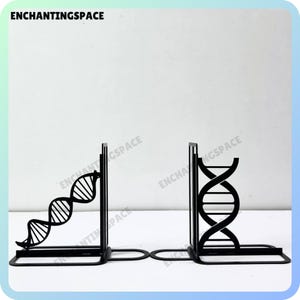 May include: Black metal bookends shaped like a double helix DNA strand. The bookends are on a white background.