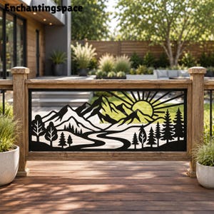 May include: A black metal decorative railing panel featuring a laser-cut landscape design. The scene depicts a mountain range, a winding river, a sun with radiating beams, and a forest of pine trees. The panel is mounted within a wooden frame.